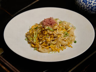 plate of scrambled egg with fish maw and hairy crab claw meat by mott 32