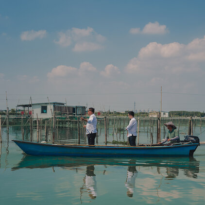 two chefs on a boat in lake sailing