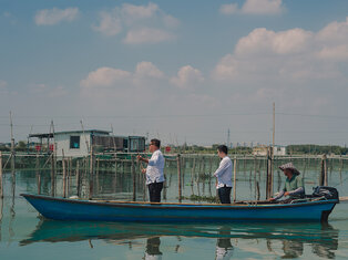 two chefs on a boat in lake sailing