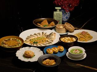 a table spread of hairy crab dishes by mott 32 hong kong
