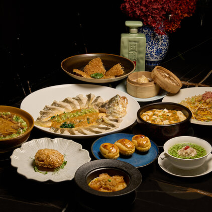 a table spread of hairy crab dishes by mott 32 hong kong